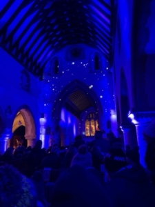 Winter scene nativity scene in a church blue lighted